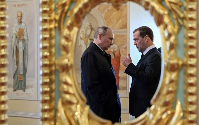 (FILES) In this file photo taken on November 15, 2017 Russian President Vladimir Putin (L) and Prime Minister Dmitry Medvedev visit the New Jerusalem Orthodox Monastery outside the town of Istra, some 70 km outside Moscow. - Russia's government resigned in a shock announcement on January 15, 2020 after President Vladimir Putin proposed a series of constitutional reforms. In a televised meeting with the Russian president, Prime Minister Dmitry Medvedev said the proposals would make significant changes to the country's balance of power and so "the government in its current form has resigned". (Photo by Yekaterina SHTUKINA / SPUTNIK / AFP)