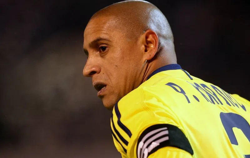 FC Anzhi Makhachkala's Brazil defender Roberto Carlos looks on during the Russian Football League Championship match against FC Zenit St. Petersburg in St. Petersburg on March 21, 2011. AFP PHOTO / KIRILL KUDRYAVTSEV