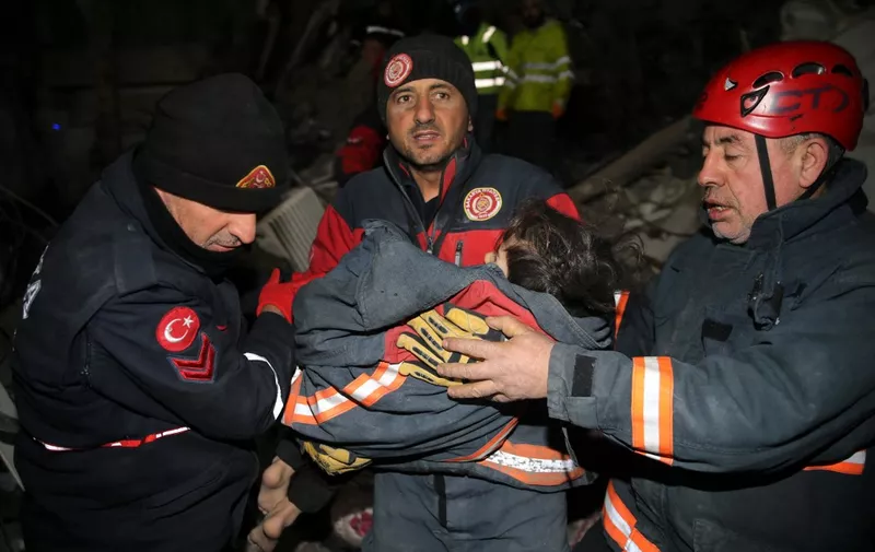 KAHRAMANMARAS, TURKIYE - FEBRUARY 09: 5-year-old Mir Berzan Bagis, along with her mother and father rescued by search and rescue teams from under rubble of a collapsed building 73 hours after 7.7 and 7.6 magnitude earthquakes hit Turkiye's Kahramanmaras, on February 09, 2023. Health condition of 5-year-old girl, Mir Berzan Bagis was reported to be stable, and the family of 3 transferred to a hospital. Early Monday morning, a strong 7.7 earthquake, centered in the Pazarcik district, jolted Kahramanmaras and strongly shook several provinces, including Gaziantep, Sanliurfa, Diyarbakir, Adana, Adiyaman, Malatya, Osmaniye, Hatay, and Kilis. Later, at 13.24 p.m. (1024GMT), a 7.6 magnitude quake centered in Kahramanmaras' Elbistan district struck the region. Turkiye declared 7 days of national mourning on Feb. 06 after deadly earthquakes in southern provinces. Serhat Zafer / Anadolu Agency (Photo by Serhat Zafer / ANADOLU AGENCY / Anadolu Agency via AFP)