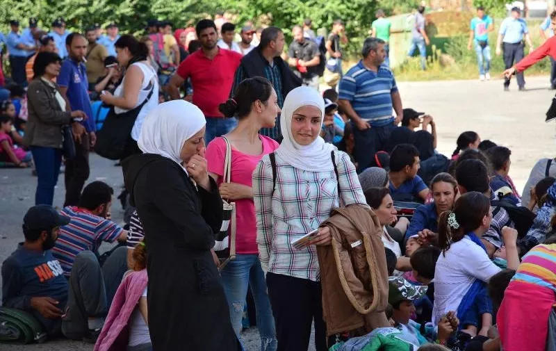 18.09.2015., Beli Manastir - Gotovo 11000 izbjeglica raspodjelili su se po gradu, a najveca je guzva zeljeznickom kolodvoru. Photo: Ivica Galovic/ PIXSELL