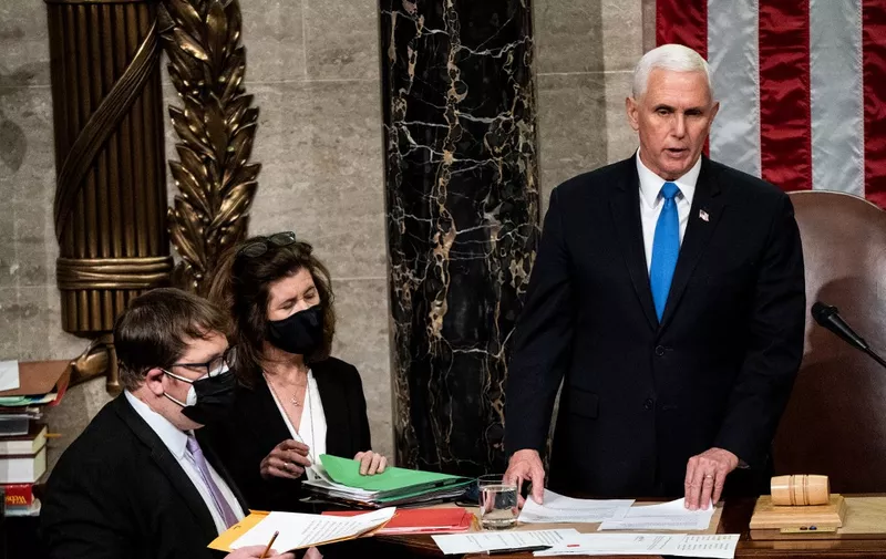 Vice President Mike Pence presides over a Joint session of Congress to certify the 2020 Electoral College results after supporters of President Donald Trump stormed the Capitol earlier in the day on Capitol Hill in Washington, DC on January 6, 2021. - Members of Congress returned to the House Chamber after being evacuated when protesters stormed the Capitol and disrupted a joint session to ratify President-elect Joe Biden's 306-232 Electoral College win over President Donald Trump. (Photo by Erin Schaff / POOL / AFP)