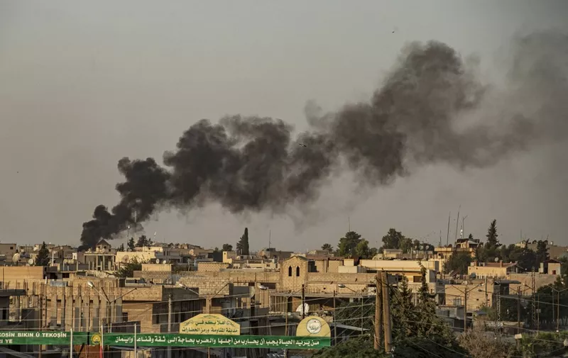 Smoke billows following Turkish bombardment on Syria's northeastern town of Ras al-Ain in the Hasakeh province along the Turkish border on October 9, 2019. - Turkey launched an assault on Kurdish forces in northern Syria with air strikes and explosions reported along the border. President Recep Tayyip Erdogan announced the start of the attack on Twitter, labelling it "Operation Peace Spring". (Photo by Delil SOULEIMAN / AFP)