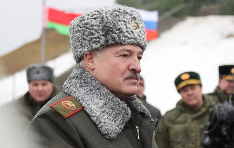 Belarus' President Alexander Lukashenko attends a joint exercises of the armed forces of Russia and Belarus as part of an inspection of the Union State's Response Force, at a firing range near a town of Osipovichi outside Minsk on February 17, 2022. (Photo by Maxim GUCHEK / BELTA / AFP) / Belarus out
