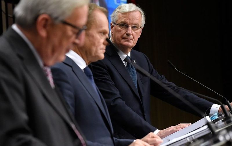 Froml left : President of the European Commission Jean-Claude Juncker, European Council President Donald Tusk and EU chief Brexit negotiator Michel Barnier give a press conference after a special meeting of the European Council to endorse the draft Brexit withdrawal agreement and to approve the draft political declaration on future EU-UK relations on November 25, 2018 in Brussels. (Photo by JOHN THYS / AFP)