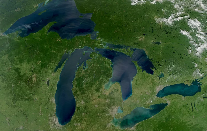 NASA image acquired August 28, 2010

Late August 2010 provided a rare satellite view of a cloudless summer day over the entire Great Lakes region. North Americans trying to sneak in a Labor Day weekend getaway on the lakes were hoping for more of the same.
The Great Lakes comprise the largest collective body of fresh water on the planet, containing roughly 18 percent of Earth's supply. Only the polar ice caps contain more fresh water. The region around the Great Lakes basin is home to more than 10 percent of the population of the United States and 25 percent of the population of Canada.
Many of those people have tried to escape record heat this summer by visiting the lakes. What they found, according to The Hamilton Spectator, was record-breaking water temperatures fueled by record-breaking air temperatures in the spring and summer. By mid-August, the waters of Lake Superior were 6 to 8°C (11 to 14°F) above normal. Lake Michigan set records at about 4°C (7°F) above normal. The other three Great Lakes – Huron, Erie, and Ontario -- were above normal temperatures, though no records were set.
The image was gathered by the Moderate Resolution Imaging Spectroradiometer (MODIS) on NASA’s Aqua satellite at 1:30 p.m. Central Daylight Time (18:30 UTC) on August 28. Open water appears blue or nearly black. The pale blue and green swirls near the coasts are likely caused by algae or phytoplankton blooms, or by calcium carbonate (chalk) from the lake floor. The sweltering summer temperatures have produced an unprecedented bloom of toxic blue-green algae in western Lake Erie, according to the Cleveland Plain Dealer.
	.	References
	.	Environmental Protection Agency. (n.d.) The Great Lakes Atlas. Accessed September 3, 2010.
	.	The Cleveland Plain Dealer. (August 22, 2010) Scientists say the toxic blue-green algae will only get worse on Ohio lakes. Accessed September 3, 2010.
	.	The Hamilton Spectator. (August 13, 2010) Great Lakes turn to 'bath water.' Accessed September 3, 2010.
NASA image by Jeff Schmaltz, MODIS Rapid Response Team, Goddard Space Flight Center. Caption by Mike Carlowicz.
Instrument: 
Aqua - MODIS

Click here to see more images from <b><a href="http://earthobservatory.nasa.gov/"> NASA Goddard’s Earth Observatory</a></b>

<b><a href="http://www.nasa.gov/centers/goddard/home/index.html" rel="nofollow">NASA Goddard Space Flight Center</a></b>  is home to the nation's largest organization of combined scientists, engineers and technologists that build spacecraft, instruments and new technology to study the Earth, the sun, our solar system, and the universe.

<b>Follow us on <a href="http://twitter.com/NASA_GoddardPix" rel="nofollow">Twitter</a></b>

<b>Join us on <a href="http://www.facebook.com/pages/Greenbelt-MD/NASA-Goddard/395013845897?ref=tsd" rel="nofollow">Facebook</a></b>