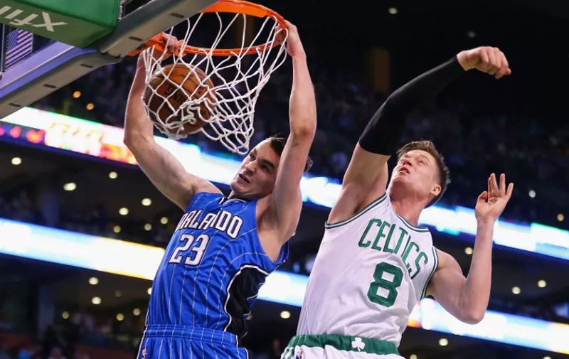 BOSTON, MA - JANUARY 29: Jonas Jerebko #8 of the Boston Celtics defends a shot by Mario Hezonja #23 of the Orlando Magic during the second quarter at TD Garden on January 29, 2016 in Boston, Massachusetts. NOTE TO USER: User expressly acknowledges and agrees that, by downloading and/or using this photograph, user is consenting to the terms and conditions of the Getty Images License Agreement.   Maddie Meyer/Getty Images/AFP