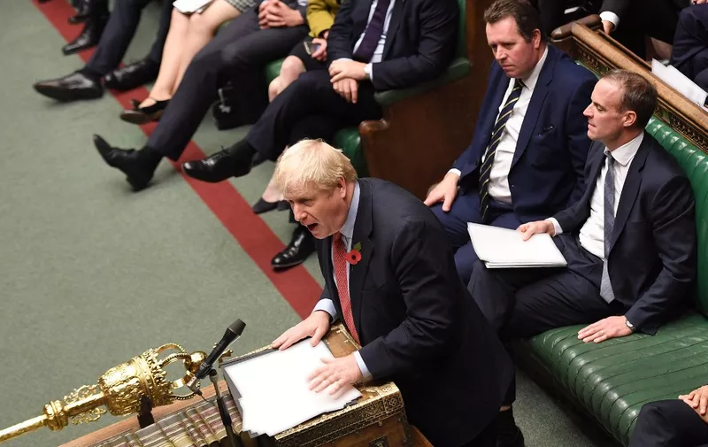 A handout picture released by the UK Parliament shows shows Britain's Prime Minister Boris Johnson speaking in the House of Commons in London on October 29, 2019, during a debate on the Early Parliamentary General Election Bill: Second Reading. - Britain was on course for a December election Tuesday after the main opposition Labour party said it would support Prime Minister Boris Johnson's plan, although a date has not yet been fixed. Labour leader Jeremy Corbyn said: "I have consistently said that we are ready for an election and our support is subject to a 'no deal' Brexit being off the table." (Photo by JESSICA TAYLOR / various sources / AFP) / RESTRICTED TO EDITORIAL USE - MANDATORY CREDIT " AFP PHOTO / UK PARLIAMENT / Jessica Taylor " - NO USE FOR ENTERTAINMENT, SATIRICAL, MARKETING OR ADVERTISING CAMPAIGNS - EDITORS NOTE THE IMAGE HAS BEEN DIGITALLY ALTERED AT SOURCE TO OBSCURE VISIBLE DOCUMENTS /