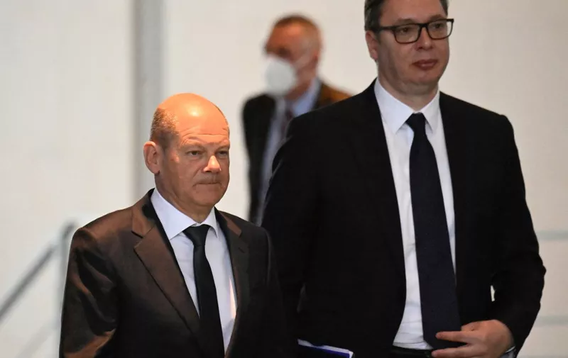 German Chancellor Olaf Scholz (L) and Serbia's President Aleksandar Vucic arrive to address a press conference at the Chancellery in Berlin on May 4, 2022. (Photo by Tobias SCHWARZ / AFP)