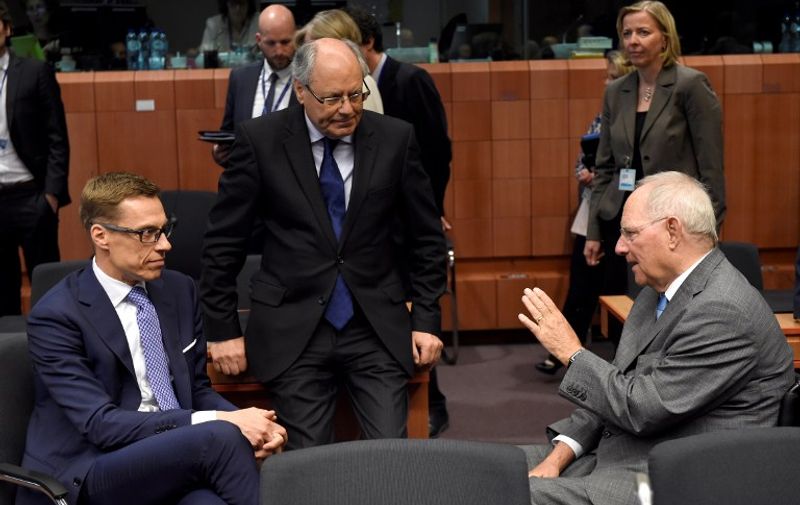German Finance Minister Wolfgang Schaeuble (R) talks with Maltese Finance minister Edward Scicluna (C) and Finnish Finance Minister Alexander Stubb (L) during a Eurogroup meeting at the European Union headquarters in Brussels on May 24, 2016.
Eurozone finance ministers said they hoped to unlock vital bailout cash for Greece on May 24, but warned of tough talks on debt relief that the IMF has demanded as the price for staying with the programme. / AFP PHOTO / JOHN THYS
