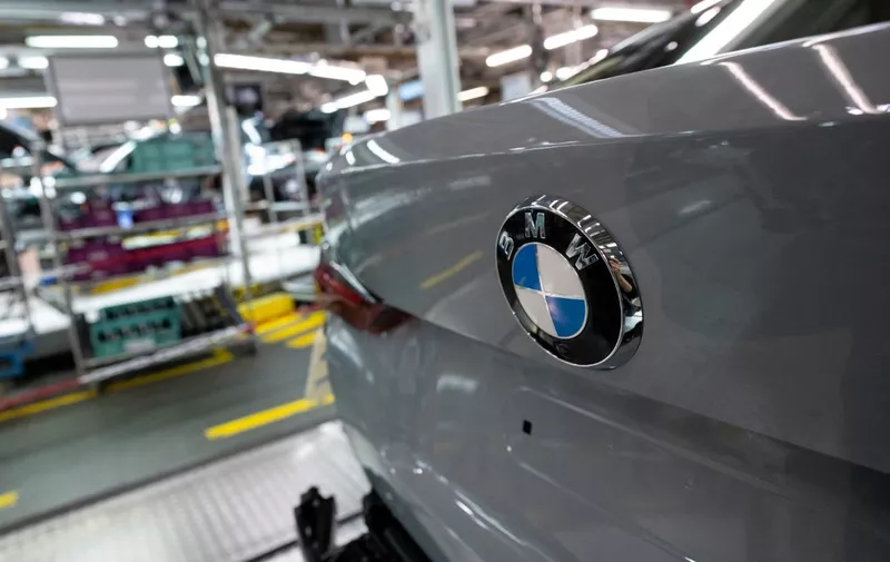 22 October 2021, Bavaria, Munich: Various BMW models run along a conveyor belt in assembly at the main plant. Photo: Sven Hoppe/dpa (Photo by SVEN HOPPE / DPA / dpa Picture-Alliance via AFP)