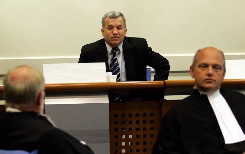 Bosnian Serb Radoslav Brdjanin, 56, listens to his verdict in the courtroom of the International Criminal Tribunal for former Yougoslavia in the Hague, 01 September 2004. The UN war crimes court 01 September acquitted former Bosnian Serb political leader Radoslav Brdjanin of genocide charges related to the ethnic cleansing camping in the Krajina region of northwestern Bosnia during the 1992-1995 war.   AFP PHOTO  CONTINENTAL/Michael Kooren (Photo by MICHAEL KOOREN / ANP / AFP)