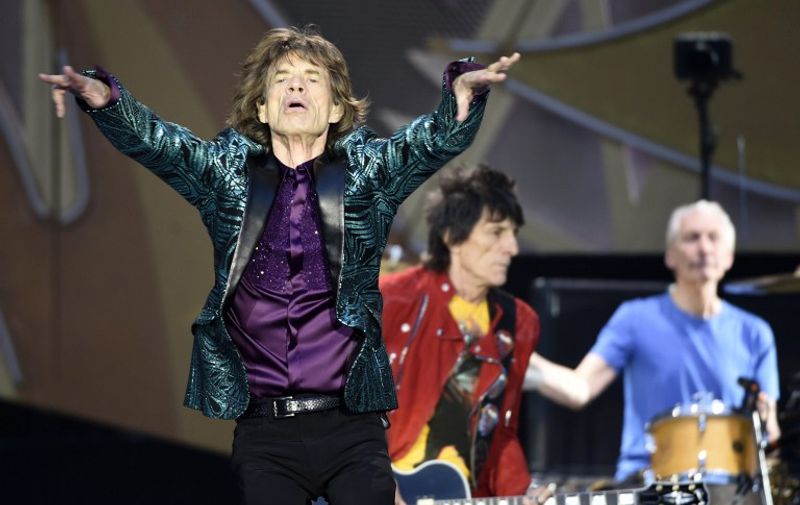 (FILES) In a file picture taken on June 14, 2014 (FromL) Mick Jagger, Ron Wood and Charlies Watts of the Rolling Stones rock band perform during a concert at the Stade de France in Saint-Denis, outside Paris. Veteran British rockers the Rolling Stones on Tuesday announced a 15-date stadium tour of North America. Mick Jagger, [&hellip;]