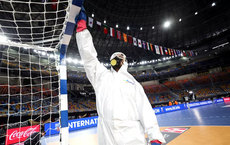 Handball - 2021 IHF Handball World Championship - Gold Medal Match - Denmark v Sweden - Cairo Stadium Hall 1, Cairo, Egypt - January 31, 2021 General view as cleaning staff disinfect the court before the final match REUTERS/Mohamed Abd El Ghany