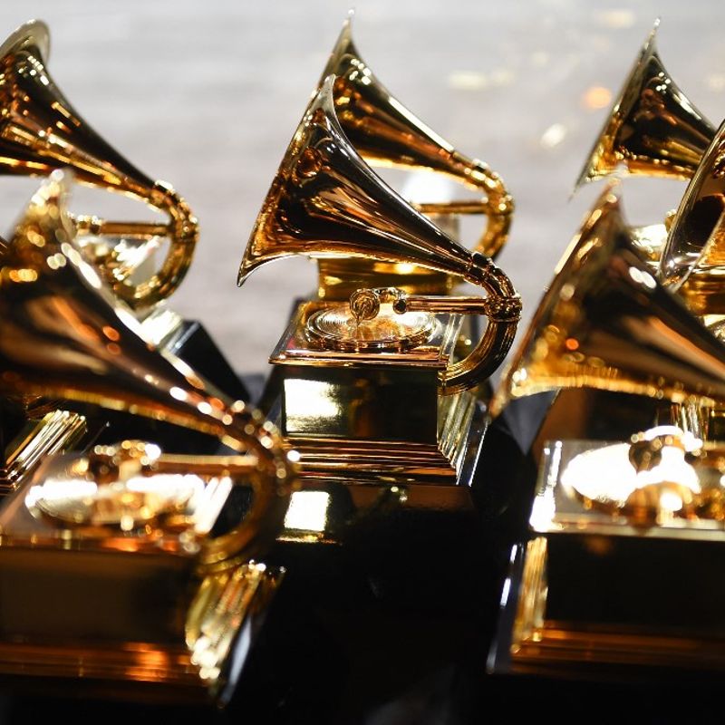 (FILES) In this file photo taken on January 28, 2018, Grammy trophies sit in the press room during the 60th Annual Grammy Awards in New York. - Beyonce leads this year's pack of Grammy nominees with nine chances at gold, ahead of rapper Kendrick Lamar coming in at eight, and balladeers Adele and Brandi Carlile scoring seven each. This year's field, announced on November 15, 2022, sets the stage for a rematch between Beyonce and Adele, after the British artist shut out the competition in major categories in 2017. (Photo by Don EMMERT / AFP)