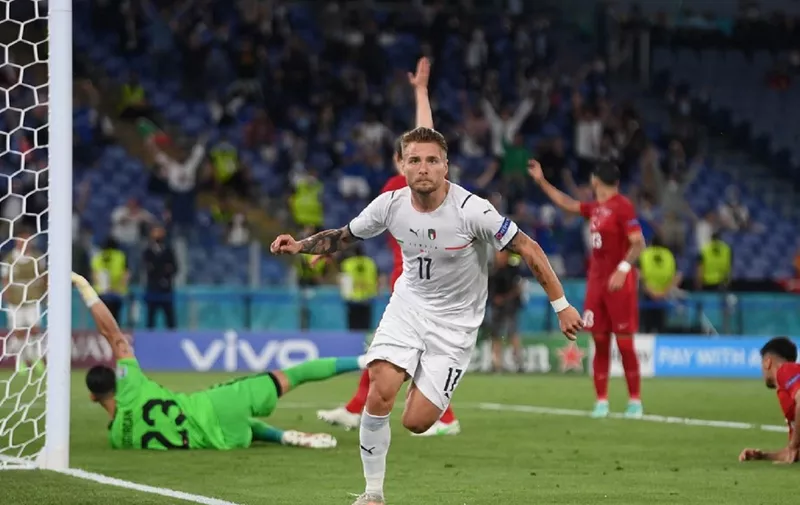 Italy's forward Ciro Immobile celebrates scoring the team's second goal during the UEFA EURO 2020 Group A football match between Turkey and Italy at the Olympic Stadium in Rome on June 11, 2021. (Photo by Mike Hewitt / POOL / AFP)