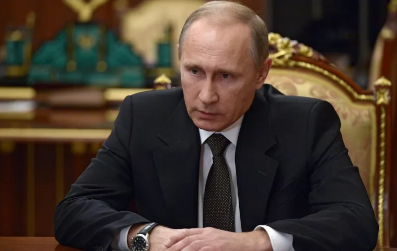 Russian President Vladimir Putin chairs a meeting with security chiefs on the results of the investigation into the Russian MetroJet Airbus A321 crash at the Kremlin in Moscow early on November 17, 2015. Russian President Vladimir Putin pledged to step up air strikes in Syria after Moscow confirmed a bomb brought down a Russian passenger jet in Egypt last month, the Kremlin said on November 17. AFP PHOTO / SPUTNIK / ALEXEI NIKOLSKY / AFP / SPUTNIK / ALEXEI NIKOLSKY