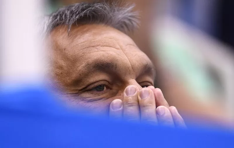 Hungary's Prime Minsiter Viktor Orban reacts during the Hungary vs Russia waterpolo Bronze medal match during their Rio 2016 Olympic Games, on August 19, 2016 at the Olympic Aquatics Stadium in Rio de Janeiro. 
 / AFP PHOTO / GABRIEL BOUYS