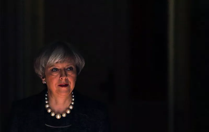 Britain's Prime Minister Theresa May leaves 10 Downing Street in central London on May 25, 2017.
Britain's Prime Minister Theresa May said Thursday she would raise the issue of leaks from a probe into the Manchester terror attack that have infuriated British authorities with their US counterparts. Speaking ahead of her departure for a NATO summit in Brussels, May said she would "make clear to President (Donald) Trump that intelligence which is shared between our law enforcement agencies must remain secure".
 / AFP PHOTO / Daniel LEAL-OLIVAS