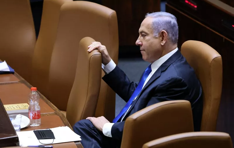 Israel's Prime Minister Benjamin Netanyahu attends a special session to vote on a new government at the Knesset in Jerusalem, on June 13, 2021. - A delicate eight-party alliance united by animosity for Netanyahu is poised to take over with right-wing Naftali Bennett as prime minister, if the coalition deal passes today's slated parliamentary vote. (Photo by EMMANUEL DUNAND / AFP)
