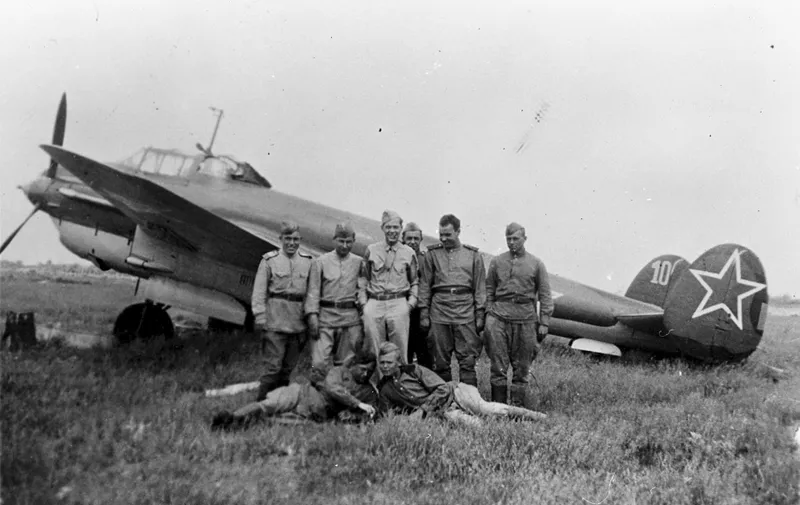 Russian pilots and ground crew stand in front of a YAK-4 bomber at Poltava, Russia, during the first shuttle raid -- Italy to Russia and return -- in June 1944. GI is TSgt. Bernard J. McGuire, Tonawanda, N.Y., of the 348th Bomb Squadron, 99th Bomb Group. (U.S. Air Force photo)
