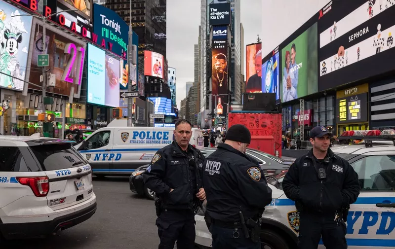 New York police officers are seen in Times Square on December 15, 2021 in New York City, New York. (Photo by Yuki IWAMURA / AFP)