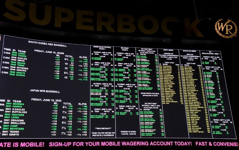 LAS VEGAS, NEVADA - JUNE 18: Betting lines are displayed at the Race &amp; Sports SuperBook at the Westgate Las Vegas Resort &amp; Casino, which features new screens on its entire 240-by-20 foot, 4,488-square-foot HD video layout, after the property opened for the first time since being closed in mid-March because of the coronavirus (COVID-19) pandemic on June 18, 2020 in Las Vegas, Nevada. Hotel-casinos throughout the state were allowed to open on June 4 as part of a phased reopening of the economy with social distancing guidelines and other restrictions in place. The Westgate, which first opened as the International in 1969, had planned to reopen with designated non-smoking, mask-required table games over half of its casino floor, as well as designated mask-required elevators. On Wednesday, citing updated guidance from the Centers for Disease Control and Prevention, the Nevada Gaming Control Board issued an industry notice updating its health and safety policy. It dictates that all players at table and card games must wear face coverings if there is no barrier between the dealer and each player. The policy applies to spectators or anyone else within six feet of a game. Also, properties must offer face masks or cloth coverings to guests as they enter the casino or have dedicated signage alerting patrons that they are available.   Ethan Miller/Getty Images/AFP (Photo by Ethan Miller / GETTY IMAGES NORTH AMERICA / Getty Images via AFP)