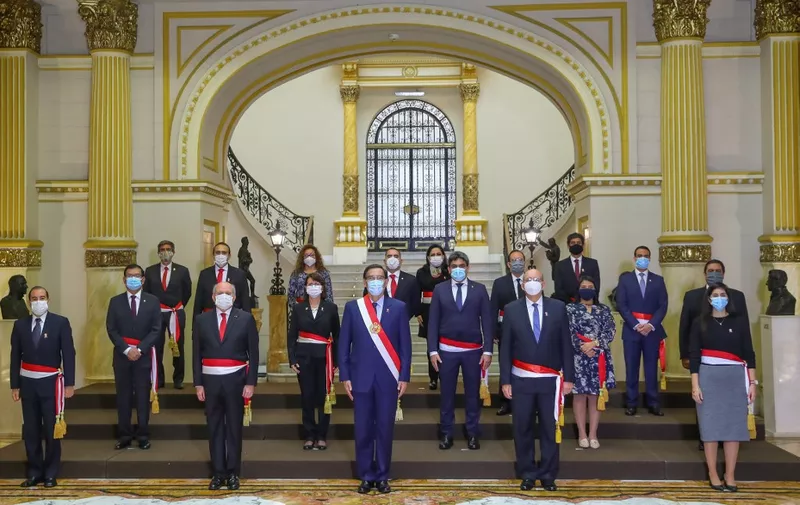 Handout picture released by Peru's Presidency of Peru's newly sworn Ministers, including Prime Minister Pedro Cateriano and Health Minister Pilar Mazzetti, standing for a group picture next to President Martin Vizcarra (front C) following their inauguration ceremony at the Golden Salon in the Presidential Palace in Lima on July 15, 2020. - Vizcarra reshuffled most of his cabinet, including his Health Minister, amid the COVID-19 novel coronavirus pandemic. (Photo by - / PRESIDENCIA DEL PERU / AFP) / RESTRICTED TO EDITORIAL USE - MANDATORY CREDIT "AFP PHOTO / PERU'S PRESIDENCY " - NO MARKETING - NO ADVERTISING CAMPAIGNS - DISTRIBUTED AS A SERVICE TO CLIENTS