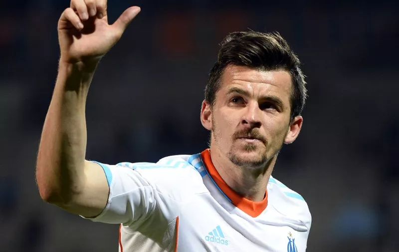 Marseille's Bristish midfielder Joey Barton waves at the end of the French L1 football match Olympique of Marseille (OM) vs Girondins de Bordeaux (FCGB) at the Velodrome stadium in Marseille, southeastern France on April 5, 2013. Marseille won 1-0.       AFP PHOTO/GERARD JULIEN