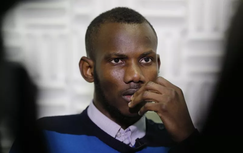 Malian Lassana Bathily, a Muslim employee who helped Jewish shoppers hide in a cold storage room from an islamist gunman during the January 9, 2015 attack, speaks on January 15 in Paris. Four people were killed by jihadist Amedy Coulibaly in a hostage-taking drama at a kosher supermarket in Paris.   AFP PHOTO / FRANCOIS GUILLOT / AFP / FRANCOIS GUILLOT