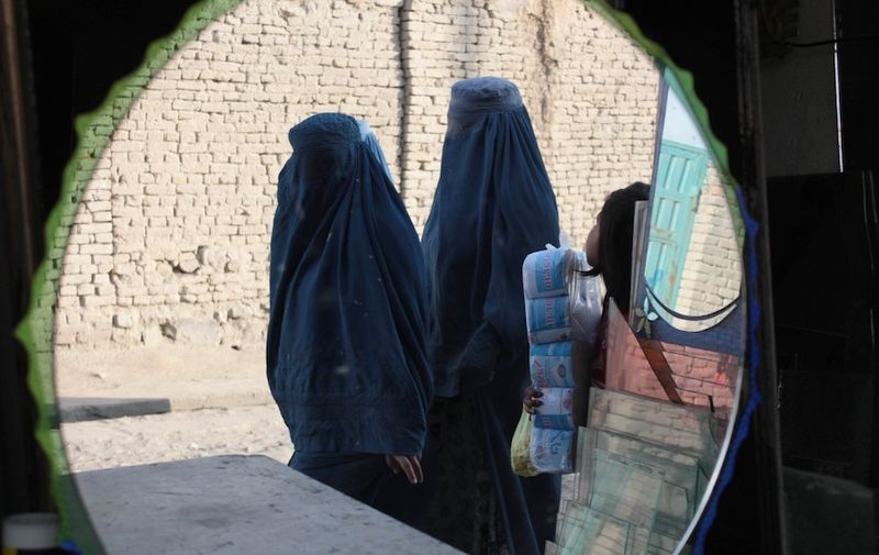 Mandatory Credit: Photo by Wali Sabawoon/NurPhoto/REX (4230282b)
Burqa-clad Afghan women are reflected on mirrors as they walk in a street market
Kabul, Afghanistan - 27 Oct 2014,Image: 225006835, License: Rights-managed, Restrictions: , Model Release: no, Credit line: Profimedia