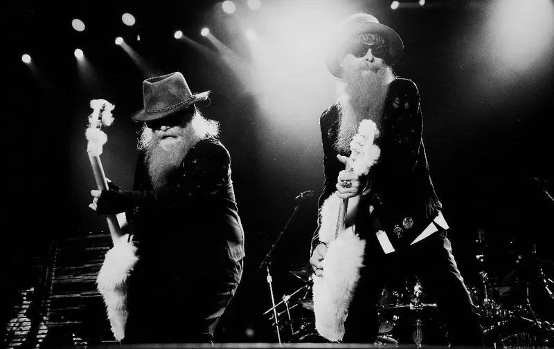 INDIO, CA - APRIL 26: (Editors Note: Image converted from color to B|W). Musicians Dusty Hill (L) and Billy Gibbons of ZZ Top perform onstage during day two of 2015 Stagecoach Of The 2015 Stagecoach California's Country Music Festiva at The Empire Polo Club on April 26, 2015 in Indio, California.   Frazer Harrison/Getty Images for Stagecoach/AFP (Photo by Frazer Harrison / GETTY IMAGES NORTH AMERICA / Getty Images via AFP)