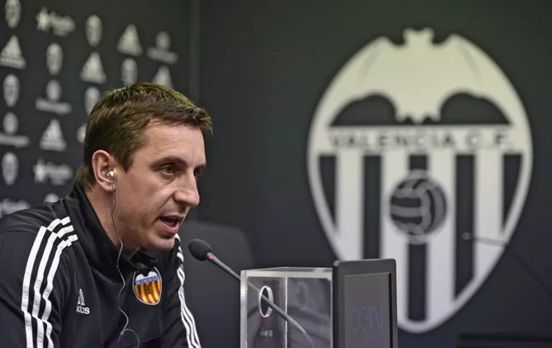 Valencia's British coach Gary Neville speaks during a press conference at the Sports City  in Valencia on February 2, 2015.  AFP PHOTO / JOSE JORDAN / AFP / JOSE JORDAN