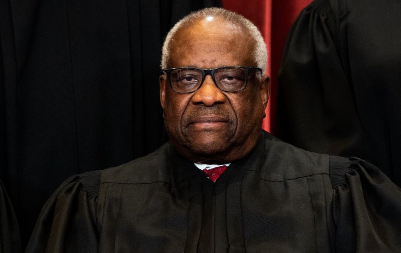 Associate Justice Clarence Thomas sits during a group photo of the Justices at the Supreme Court in Washington, DC on April 23, 2021. (Photo by Erin Schaff / POOL / AFP)