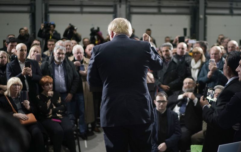 MANCHESTER, ENGLAND - DECEMBER 10: British Prime Minister Boris Johnson speaks to supporters during a general election campaign event at the Globus Group factory on December 10, 2019 in Manchester, England. The U.K. will go to the polls in a general election on December 12. (Photo by Christopher Furlong/Getty Images)