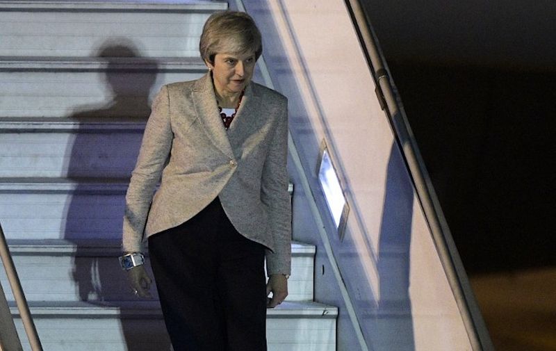 Britain's Prime Minister Theresa May steps off her plane upon arrival at Ezeiza International airport in Buenos Aires, on November 29, 2018, on the eve of the G20 Leaders' Summit. - Like Trump and Xi, Prime Minister Theresa May will arrive in Buenos Aires late on Thursday to bring another intriguing subplot to the world's pre-eminent economic forum. Britain and Argentina went to war over the Falkland/Malvinas islands in 1982, and May is the first serving British leader ever to visit the Argentine capital. (Photo by JUAN MABROMATA / AFP)