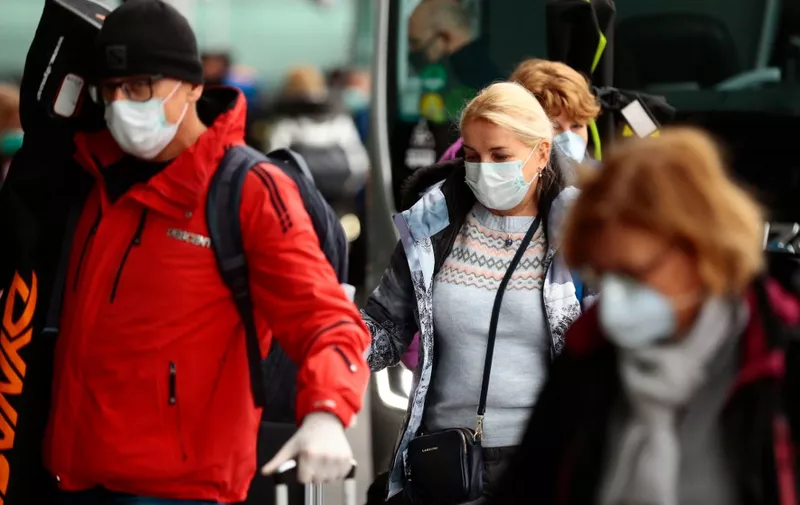 People wearing protective masks arrive at El Prat airport in Barcelona on March 16, 2020. - After the COVID-19 pandemic began in China late last year, Europe in recent weeks emerged as the biggest flashpoint and the death toll on the continent surged over the weekend.
Spain and France registered 183 and 29 new deaths respectively yesterday, their worst one-day tolls. (Photo by Pau Barrena / AFP)