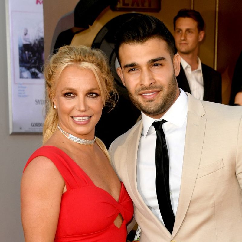 HOLLYWOOD, CALIFORNIA - JULY 22: Britney Spears (L) and Sam Asghari arrive at the premiere of Sony Pictures' "One Upon A Time...In Hollywood" at the Chinese Theatre on July 22, 2019 in Hollywood, California.   Kevin Winter/Getty Images/AFP (Photo by KEVIN WINTER / GETTY IMAGES NORTH AMERICA / Getty Images via AFP)