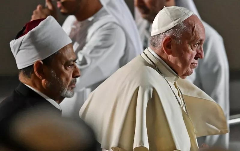 Pope Francis (R) and Egypt's Azhar Grand Imam Sheikh Ahmed al-Tayeb arrive to attend the Founders Memorial event in Abu Dhabi on February 4, 2019. (Photo by Vincenzo PINTO / AFP)