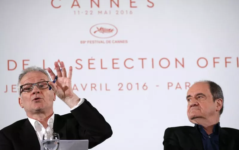 Cannes film festival general deleguate Thierry Fremaux (L) and President Pierre Lescure (R) hold a press conference to unveil the list of the 20 movies which will be shown in competition for the Palme d'Or next month, on April 14, 2016 in Paris. / AFP PHOTO / PATRICK KOVARIK
