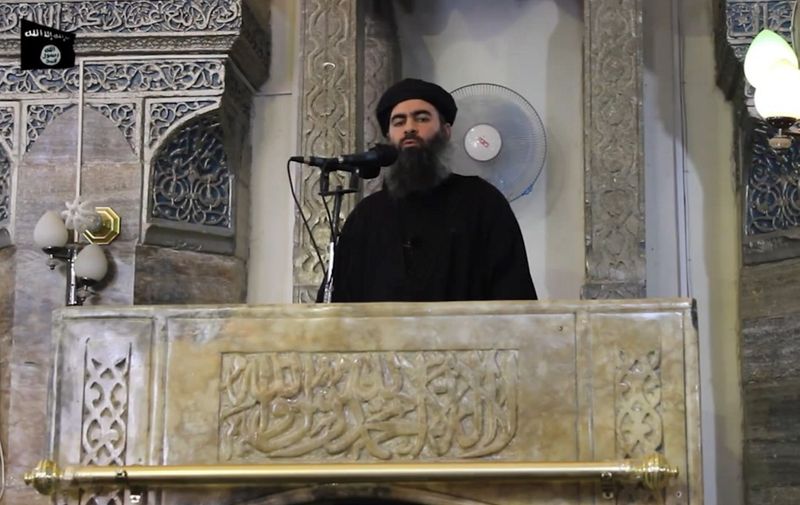 An image grab taken from a propaganda video released on July 5, 2014 by al-Furqan Media allegedly shows the leader of the Islamic State (IS) jihadist group, Abu Bakr al-Baghdadi, aka Caliph Ibrahim, adressing Muslim worshippers at a mosque in the militant-held northern Iraqi city of Mosul. Baghdadi, who on June 29 proclaimed a "caliphate" straddling Syria and Iraq, purportedly ordered all Muslims to obey him in the video released on social media.    AFP PHOTO / HO / AL-FURQAN MEDIA 
== RESTRICTED TO EDITORIAL USE - MANDATORY CREDIT "AFP PHOTO / HO / AL-FURQAN MEDIA " - NO MARKETING NO ADVERTISING CAMPAIGNS - DISTRIBUTED AS A SERVICE TO CLIENTS FROM ALTERNATIVE SOURCES, AFP IS NOT RESPONSIBLE FOR ANY DIGITAL ALTERATIONS TO THE PICTURE'S EDITORIAL CONTENT, DATE AND LOCATION WHICH CANNOT BE INDEPENDENTLY VERIFIED == (Photo by - / AL-FURQAN MEDIA / AFP)
