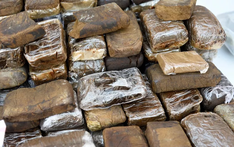 A picture taken on February 25, 2021 shows cannabis resin seized to local dealers during a visit of French Interior Minister in Marseille, southern France. (Photo by NICOLAS TUCAT / AFP)