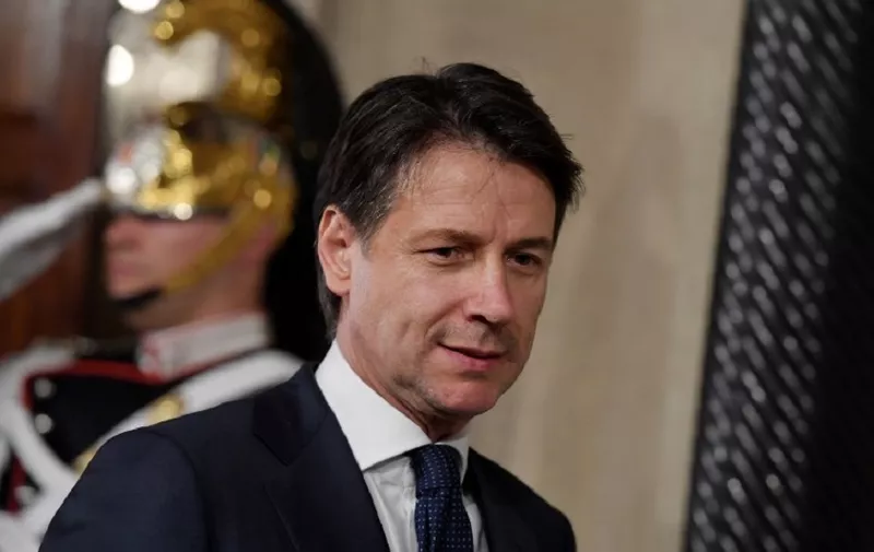 Italy's newly appointed Prime minister Giuseppe Conte leaves after announcing the list of his government at the Quirinale presidential palace on May 31, 2018 in Rome after a meeting with Italian President. / AFP PHOTO / Tiziana FABI