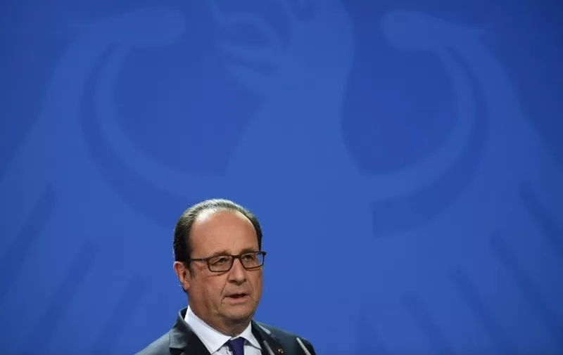 French President Francois Hollande speaks during  a press conference with German chancellor Angela Merkel (unseen) after a meeting of the leaders of Russia, Ukraine, France and Germany on a new push for peace in eastern Ukraine at the chancellery in Berlin, on October 19, 2016. / AFP PHOTO / STEPHANE DE SAKUTIN