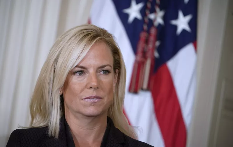 (FILES) In this file photo taken on October 12, 2017, Kirstjen Nielsen listens as US President Donald Trump nominates her as next US Secretary of Homeland Security in the East Room of the White House in Washington, DC. - US President Donald Trump on Sunday, April 7, 2019 announced Homeland Security Secretary Kirstjen Nielsen, the front-line defender of the administration's controversial immigration policies, would leave her position. "Secretary of Homeland Security Kirstjen Nielsen will be leaving her position, and I would like to thank her for her service," Trump tweeted. (Photo by Mandel NGAN / AFP)