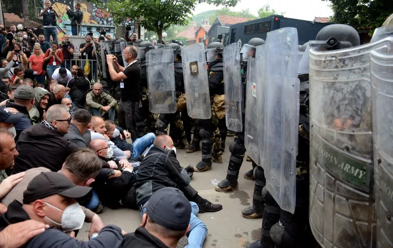 Serbs from Kosovo face riot police during their gathering to demand the removal of recently elected Albanian mayors outside municipal building in Zvecan, northern Kosovo on May 29, 2023. NATO-led peacekeepers on Monday dispersed Serb protesters who again clashed with police in northern Kosovo to demand the removal of recently elected Albanian mayors, as ethnic tensions flared in the Balkan nation. (Photo by -STR / AFP)