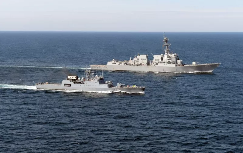 In this April 5, 2015 US Navy handout image, the USS Jason Dunham (DDG 109)(R) and the Romanian corvette ROS Sebastian (F 264) operate together during a passing exercise in the Black Sea. Jason Dunham, an Arleigh Burke-class guided-missile destroyer homeported in Norfolk, is conducting naval operations in the US 6th Fleet area of operations in support of US national security interests in Europe. AFP PHOTO / HANDOUT / US NAVY / MC3 WESTON JONES   == RESTRICTED TO EDITORIAL USE / MANDATORY CREDIT: "AFP PHOTO / HANDOUT / US NAVY / MC3 WESTON JONES   "/ NO MARKETING / NO ADVERTISING CAMPAIGNS / NO A LA CARTE SALES / DISTRIBUTED AS A SERVICE TO CLIENTS ==