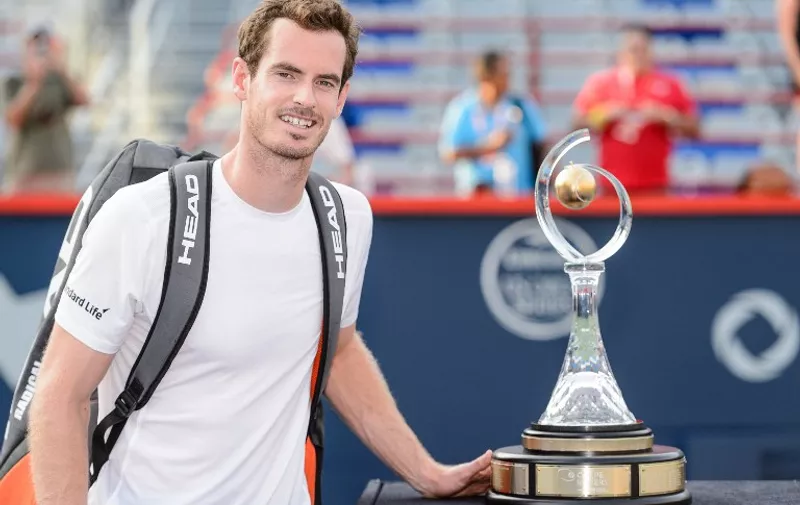 MONTREAL, ON - AUGUST 16: Andy Murray of Great Britain poses with the Rogers Cup after defeating Novak Djokovic of Serbia 6-4, 4-6, 6-3 during day seven of the Rogers Cup at Uniprix Stadium on August 16, 2015 in Montreal, Quebec, Canada.   Minas Panagiotakis/Getty Images/AFP