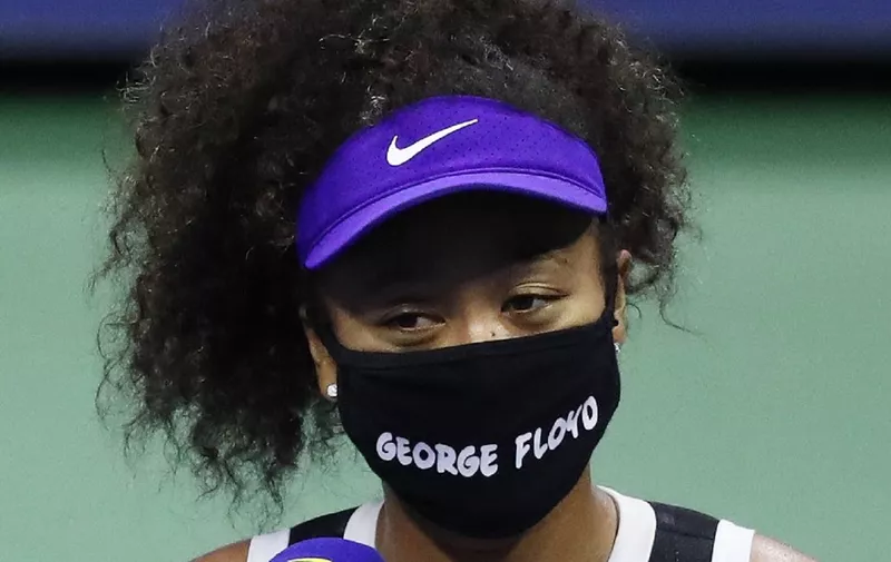 NEW YORK, NEW YORK - SEPTEMBER 08: Naomi Osaka of Japan wears a mask with the name of George Floyd on it during an interview following her Women’s Singles quarter-finals match win against Shelby Rogers of the United States on Day Nine of the 2020 US Open at the USTA Billie Jean King National Tennis Center on September 8, 2020 in the Queens borough of New York City.   Matthew Stockman/Getty Images /AFP