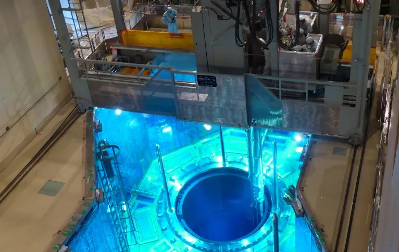 This handout picture taken by Kyushu Electric Power on July 7, 2015 shows a fuel rod being inserted in a reactor vessel at the Kyushu Electric Power's Sendai nuclear power plant in Satsumasendai, Kagoshima prefecture, on Japan's southern island of Kyushu. Atomic fuel was being loaded into the reactor in southern Japan on July 7 as its operator prepared to restart operations despite widespread public opposition to the technology. The reactor is expected to become the first one to go back on line after two years of complete hiatus in Japan following the tsunami-sparked disaster at Fukushima in 2011. AFP PHOTO / KYUSHU ELECTRIC POWER  ---EDITORS NOTE---HANDOUT RESTRICTED TO EDITORIAL USE - MANDATORY CREDIT "AFP PHOTO /  KYUSHU ELECTRIC POWER" - NO MARKETING NO ADVERTISING CAMPAIGNS - DISTRIBUTED AS A SERVICE TO CLIENTS