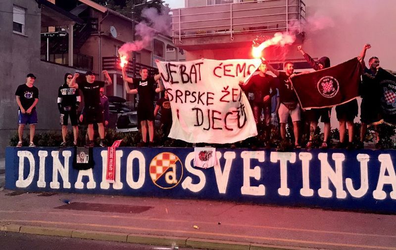 EDITORS NOTE: Graphic content / Picutre taken on June 11, 2020, in Zagreb, Croatia, shows an offensive anti-Serb banner displayed by Croatian football fans sparked outrage in the country on June 12, 2020, notably among ethnic Serbs and was strongly condemned by top officials. - The photo of about a dozen Dinamo Zagreb fans standing on an improvised stage and displaying a giant banner that read "We will fuck Serb women and children!" was put on Twitter by the Serb National Council (SNV), an umbrella organisation for Croatian Serbsaid fans chanted 'Kill, kill a Serb!' (Photo by - / AFP)